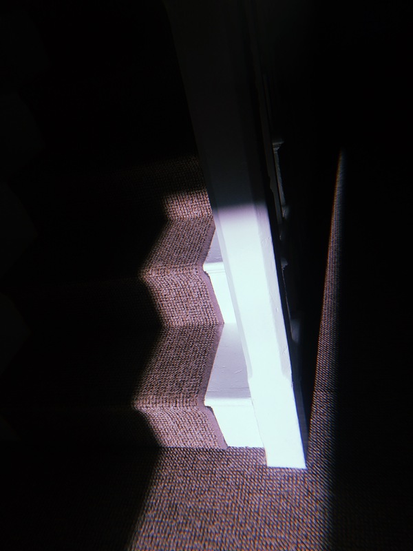 Visual imagery of shadows isolating the interior of a home. Emphasising shape and texture amongst the darkness.